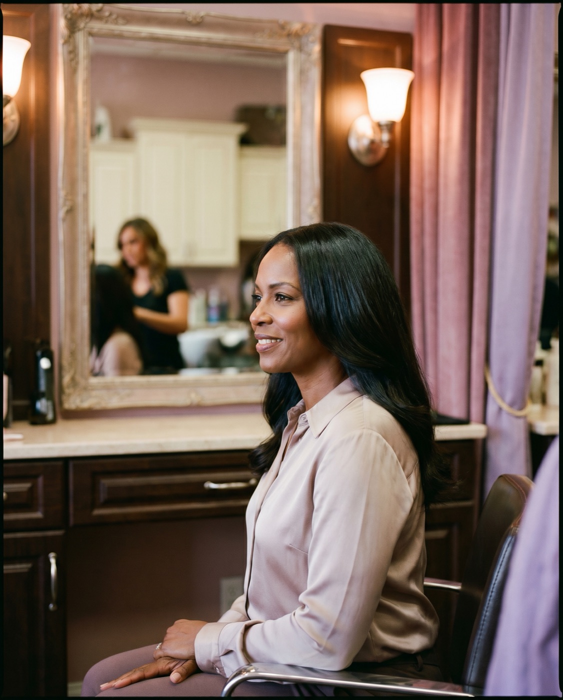 Client with a flawless silk press blowout in the MSL Salon Boutique chair